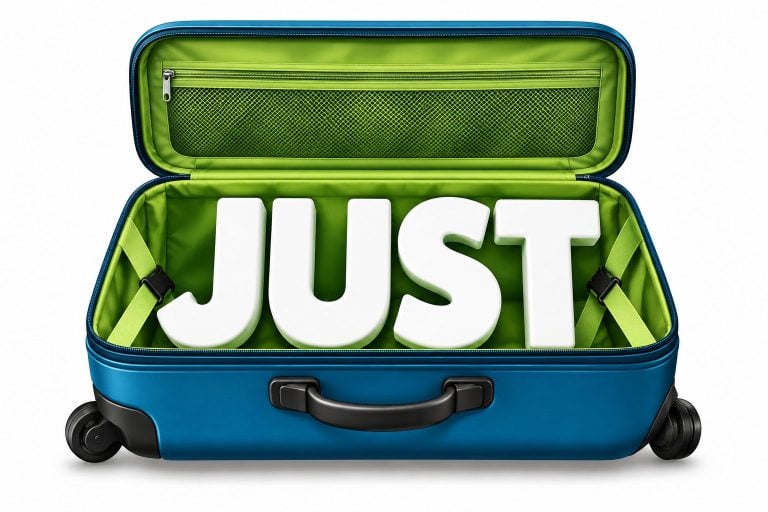 An open suitcase packed with the word JUST, alongside a passport, travel insurance and a sun hat